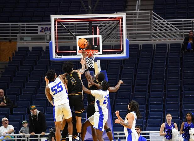 Elliott Buzzer-Beater Leads Men’s Basketball to First Win in CAA History