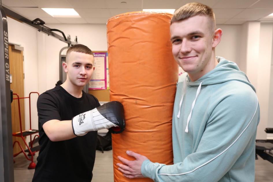 Boxing champion steps up to use sport to help local students