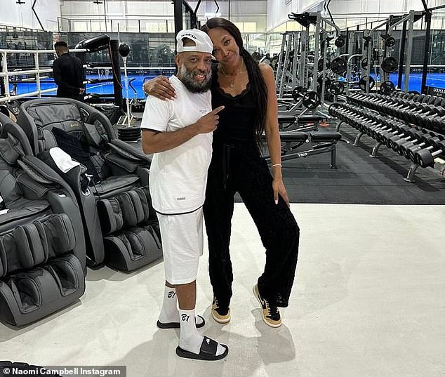 Naomi Campbell sweats while throwing punches during a boxing session