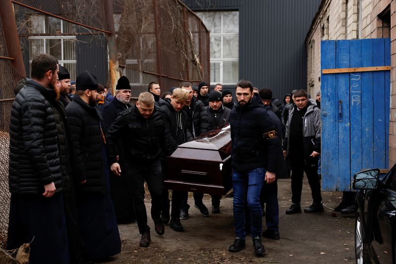 Ukraine buries boxing coach whose kitchen wall was torn out in Russian attack