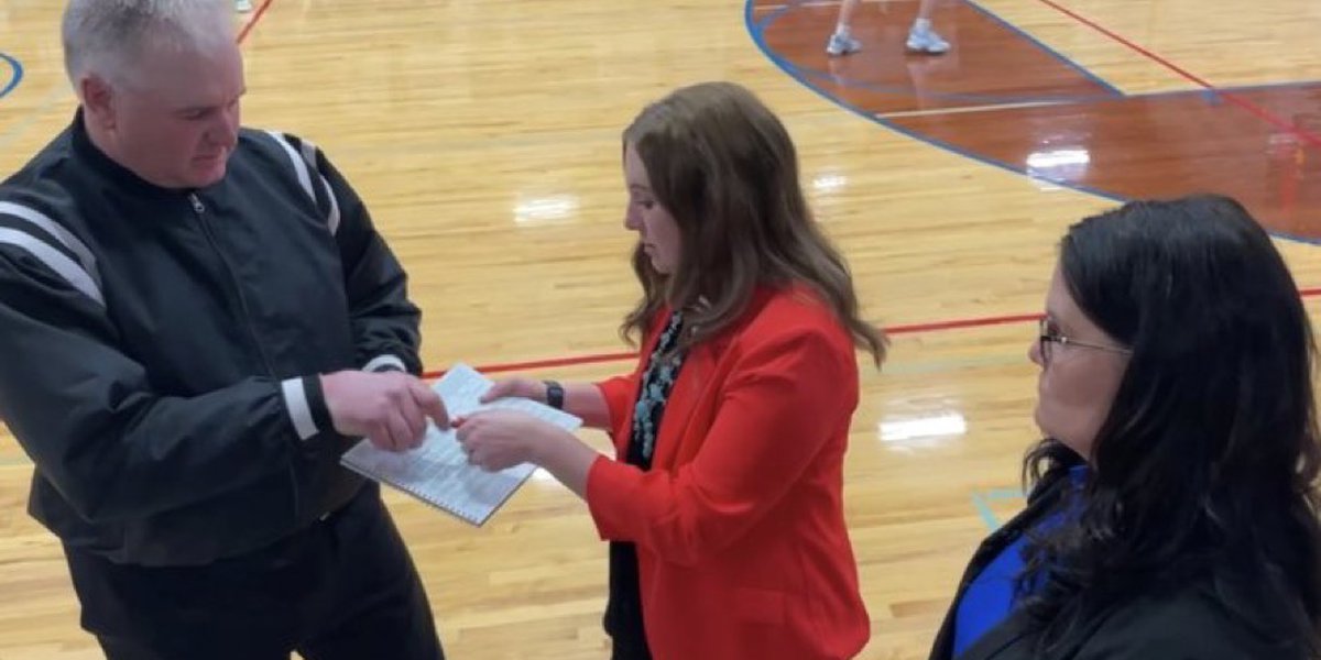 Mom, Dad, and Daughter Coach and Referee Local High School Basketball Game