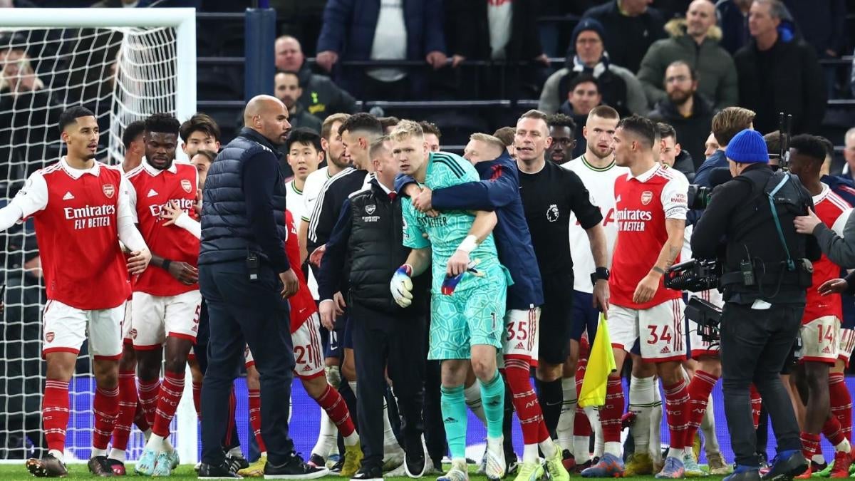 Tottenham fans kick Arsenal goalkeeper Aaron Ramsdale in the back