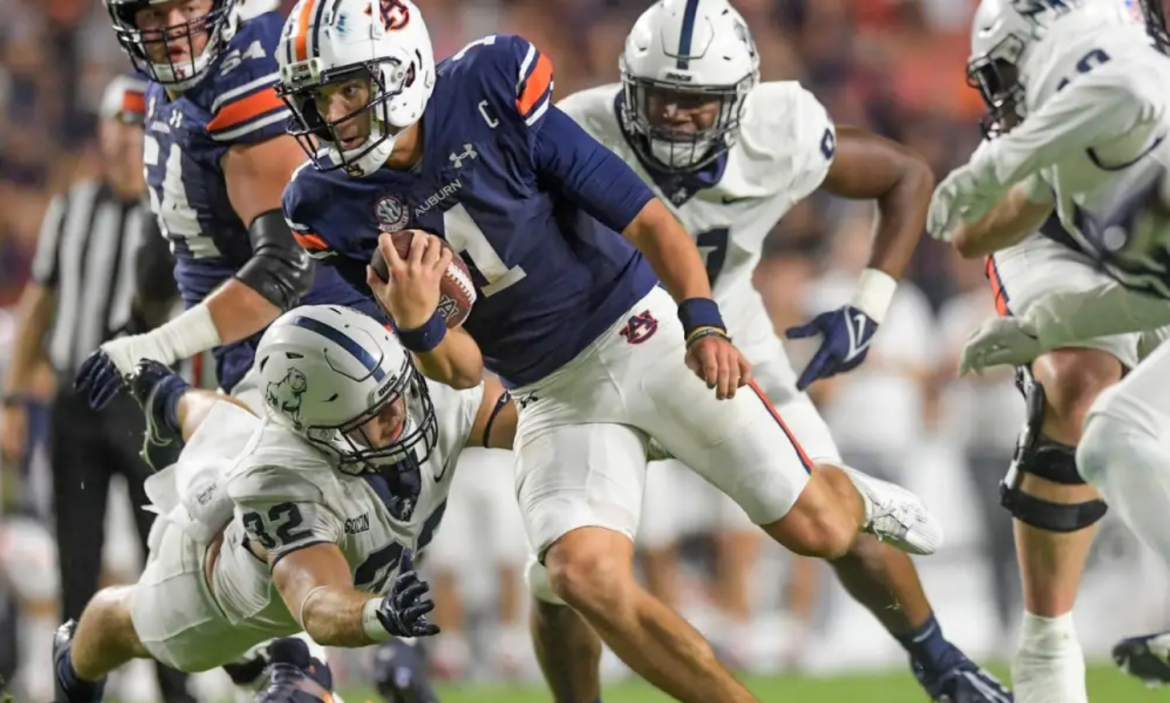 Auburn’s Freshman Phenom Faces Arkansas’ Offensive Juggernaut: Who Will Prevail?