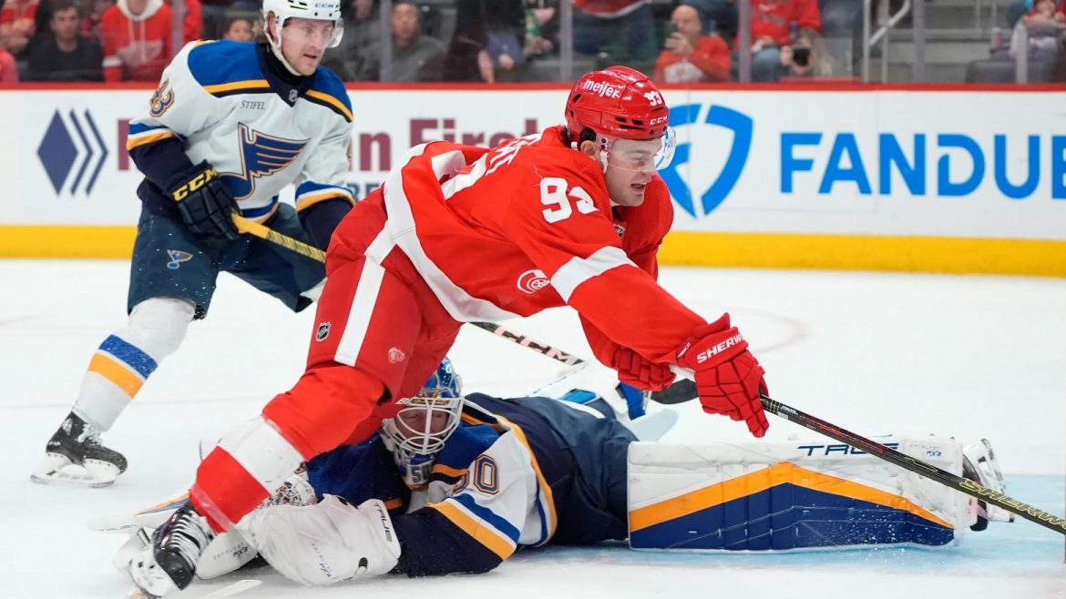 Banged-Up Blues Host Hot Red Wings in Central Division Clash